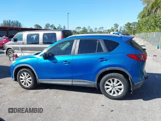 2014 Mazda CX-5 Touring with VIN JM3KE2CYXE0310873, listed as a IAAI auction lot 41309633 with 175,325 mi miles and . Bid and sale history available at DreamBid. Image 15.