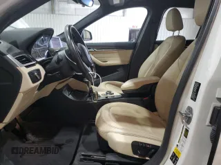 2017 BMW X1 xDrive28i with VIN WBXHT3Z34H4A54811, listed as a Copart auction lot 63584405 with 92,699 mi miles and Salvage title. Bid and sale history available at DreamBid. Image 7.