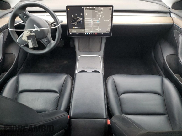 2021 Tesla Model 3 Standard Range Plus with VIN 5YJ3E1EA2MF087879, listed as a Copart auction lot 51853235 with 65,477 mi miles and Non Repairable. Bid and sale history available at carsss.com. Image 8.