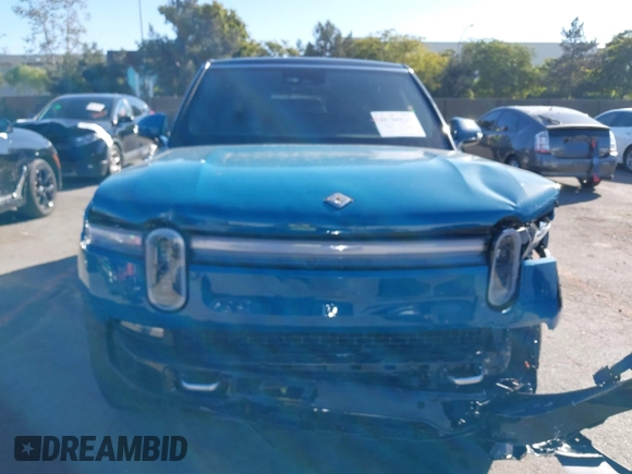 2025 Rivian R1S Adventure with VIN 7PDSGBBA9SN056202, listed as a IAAI auction lot 40766927 with 1,688 mi miles. Bid and sale history available at carsss.com. Image 12.
