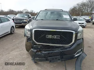 2016 GMC Yukon SLT with VIN 1GKS1BKC3GR272738, listed as a IAAI auction lot 41712439 with 169,726 mi miles. Bid and sale history available at carsss.com. Image 6.