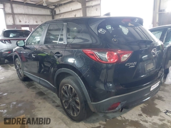 2016 Mazda CX-5 Grand Touring with VIN JM3KE4DY5G0816575, listed as a IAAI auction lot 42101340 with 180,762 mi miles and . Bid and sale history available at carsss.com. Image 3.