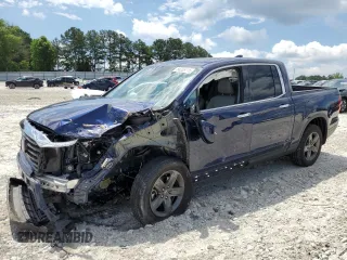 2023 Honda Ridgeline RTL-E with VIN 5FPYK3F74PB037333, listed as a Copart auction lot 56209715 with 36,041 mi miles and Salvage title. Bid and sale history available at DreamBid. Image 1.