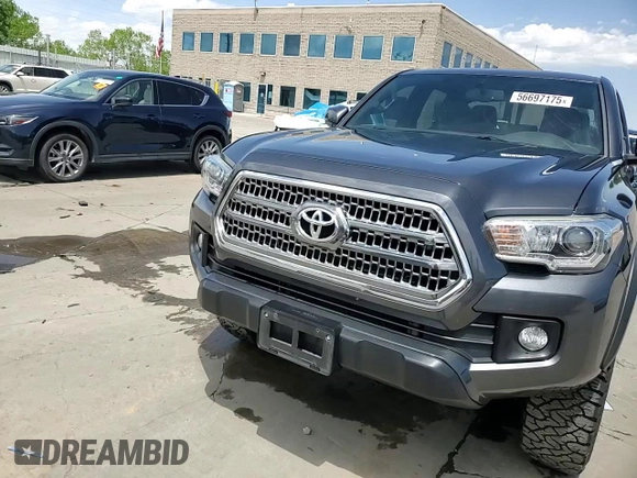 2017 Toyota Tacoma SR5 z VIN 3TMCZ5AN6HM060416, wystawiony jako Copart lot #56697175 z przebiegiem 120 029 mil mil oraz Szkoda całkowita • Salvage title. Historia ofert i sprzedaży dostępna na DreamBid. Obrazek 13.