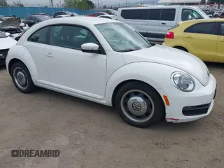 2012 Volkswagen Beetle 2.5L PZEV with VIN 3VWJP7AT9CM611600, listed as a IAAI auction lot 41903289 with 100,577 mi miles. Bid and sale history available at carsss.com. Image 1.