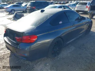 2015 BMW M4 with VIN WBS3R9C57FK334921, listed as a IAAI auction lot 41869773 with 107,058 mi miles. Bid and sale history available at carsss.com. Image 4.