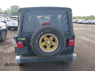 2006 Jeep Wrangler Sport z VIN 1J4FA49S06P721223, wystawiony jako IAAI lot #42654272 z przebiegiem 225 223 mil mil oraz . Historia ofert i sprzedaży dostępna na DreamBid. Obrazek 16.