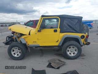 2005 Jeep Wrangler SE z VIN 1J4FA29S95P373313, wystawiony jako IAAI lot #42340611 z przebiegiem 162 801 mil mil oraz . Historia ofert i sprzedaży dostępna na DreamBid. Obrazek 14.