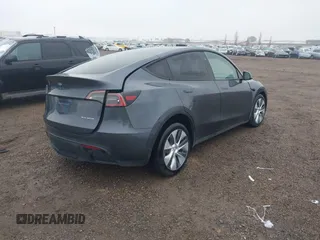 2023 Tesla Model Y Long Range with VIN 7SAYGDEE7PF894362, listed as a IAAI auction lot 41512492 with 27,513 mi miles. Bid and sale history available at carsss.com. Image 4.