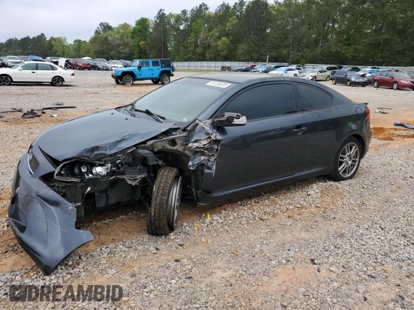 2007 Scion tC Spec z VIN JTKDE167570179636, wystawiony jako Copart lot #51235535 z przebiegiem 184 645 mil mil oraz Szkoda całkowita • Salvage title. Historia ofert i sprzedaży dostępna na DreamBid. Obrazek 1.