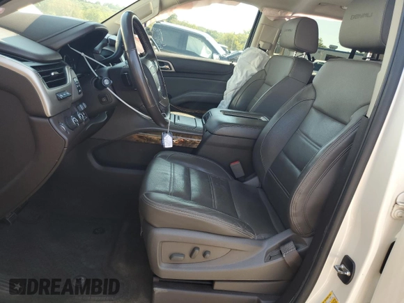 2015 GMC Yukon Denali with VIN 1GKS2CKJ3FR663324, listed as a Copart auction lot 70306614 with 154,234 mi miles and Salvage Title. Bid and sale history available at carsss.com. Image 7.