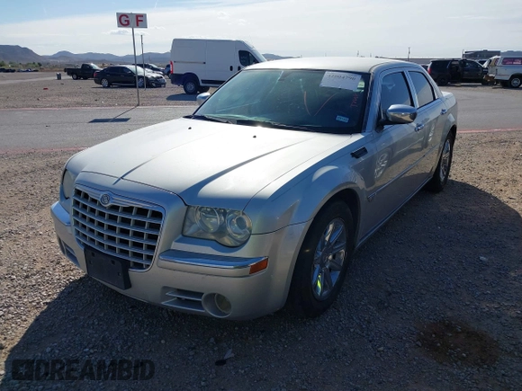 2006 Chrysler 300 C with VIN 2C3KA63H46H154990, listed as a IAAI auction lot 42004790 with 233,673 mi miles. Bid and sale history available at carsss.com. Image 2.