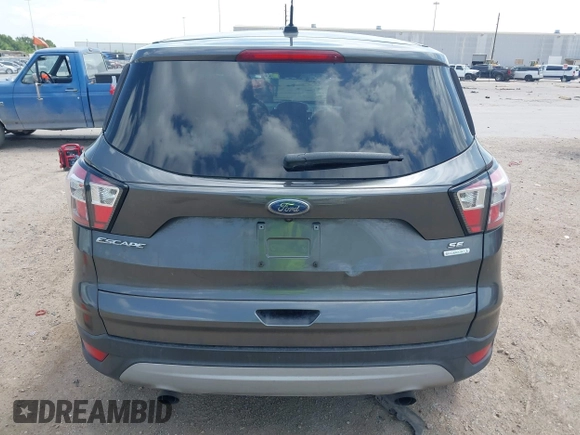2017 Ford Escape SE z VIN 1FMCU0GD1HUE71410, wystawiony jako IAAI lot #42026516 z przebiegiem 173 804 mil mil oraz . Historia ofert i sprzedaży dostępna na DreamBid. Obrazek 17.
