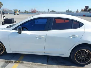 2015 Mazda 3 i SV with VIN JM1BM1T71F1218642, listed as a IAAI auction lot 42142795 with 134,143 mi miles. Bid and sale history available at carsss.com. Image 14.