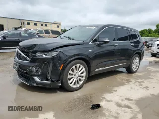 2020 Cadillac XT6 FWD Premium Luxury с VIN 1GYKPCRS9LZ148944, выставлен на аукционе Copart как лот 54406745 с пробегом 64 086 миль миль и Списание • Salvage title. История ставок и продаж доступна на DreamBid. Изображение 1.