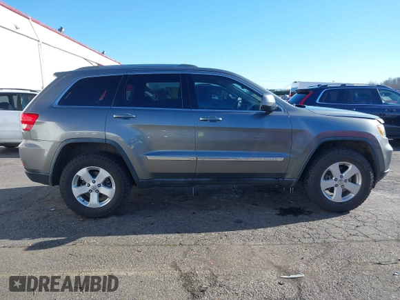 2011 Jeep Grand Cherokee Laredo with VIN 1J4RR4GG9BC714325, listed as a IAAI auction lot 41560915 with 153,372 mi miles and . Bid and sale history available at DreamBid. Image 13.