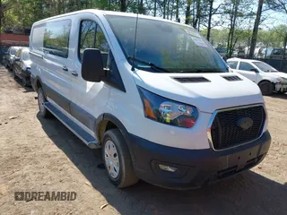 2023 Ford Transit Cargo z VIN 1FTBR1Y86PKB06577, wystawiony jako IAAI lot #42072759 z przebiegiem 16 343 mil mil oraz . Historia ofert i sprzedaży dostępna na DreamBid. Obrazek 1.