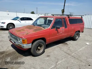 1987 Toyota Pickup с VIN JT4RN70D2H0048566, выставлен на аукционе Copart как лот 52362085 с пробегом 252 452 миль миль и Чистый • Clean title. История ставок и продаж доступна на DreamBid. Изображение 1.