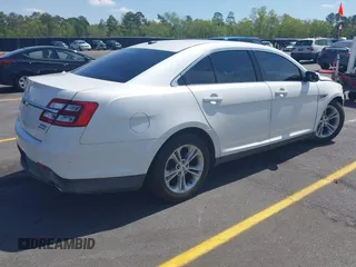 2014 Ford Taurus SEL with VIN 1FAHP2E86EG132676, listed as a IAAI auction lot 41943392 with 183,633 mi miles. Bid and sale history available at carsss.com. Image 4.