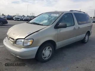 2000 Toyota Sienna LE with VIN 4T3ZF13C7YU188122, listed as a Copart auction lot 65561765 with 172,426 mi miles and Salvage title. Bid and sale history available at DreamBid. Image 1.