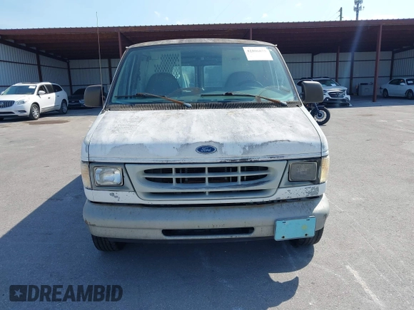 1999 Ford Econoline Cargo with VIN 1FTRE1428XHA20390, listed as a IAAI auction lot 41806875 with 207,954 mi miles. Bid and sale history available at carsss.com. Image 6.