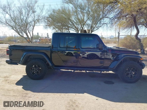 2020 Jeep Gladiator Rubicon z VIN 1C6JJTBG0LL117908, wystawiony jako IAAI lot #41621920 z przebiegiem 61 233 mil mil oraz . Historia ofert i sprzedaży dostępna na DreamBid. Obrazek 13.