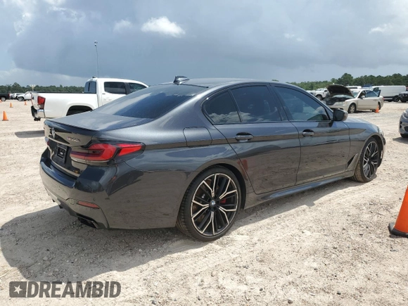 2022 BMW 5 Series M550i xDrive z VIN WBA13BK09NCJ00508, wystawiony jako Copart lot #58077634 z przebiegiem Nie podano mil oraz . Historia ofert i sprzedaży dostępna na DreamBid. Obrazek 3.