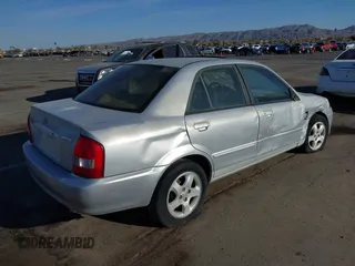 2002 Mazda Protege DX with VIN JM1BJ225X20639872, listed as a IAAI auction lot 41712272 with 145,118 mi miles and . Bid and sale history available at DreamBid. Image 4.
