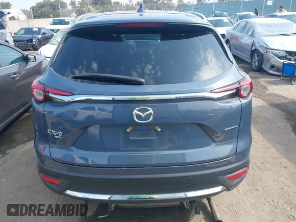 2021 Mazda CX-9 Carbon Edition z VIN JM3TCBDY0M0526352, wystawiony jako IAAI lot #42403901 z przebiegiem 50 193 mil mil oraz . Historia ofert i sprzedaży dostępna na DreamBid. Obrazek 16.
