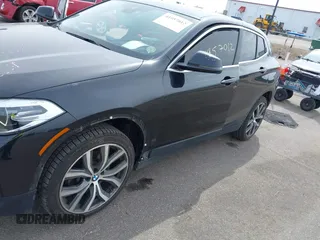 2020 BMW X2 xDrive28i with VIN WBXYJ1C02L5R71755, listed as a IAAI auction lot 41957012 with 69,997 mi miles. Bid and sale history available at carsss.com. Image 6.