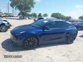 2023 Tesla Model Y Performance with VIN 7SAYGDEF9PF582908, listed as a IAAI auction lot 41930957 with 52,857 mi miles and . Bid and sale history available at DreamBid. Image 13.