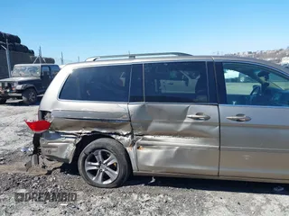 2010 Honda Odyssey Touring with VIN 5FNRL3H9XAB094765, listed as a IAAI auction lot 41892743 with 127,143 mi miles. Bid and sale history available at carsss.com. Image 6.