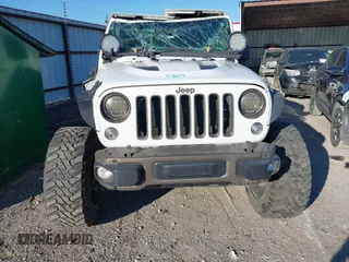2016 Jeep Wrangler Unlimited Sahara with VIN 1C4BJWEG5GL243004, listed as a IAAI auction lot 40438321 with 121,360 mi miles and . Bid and sale history available at DreamBid. Image 12.