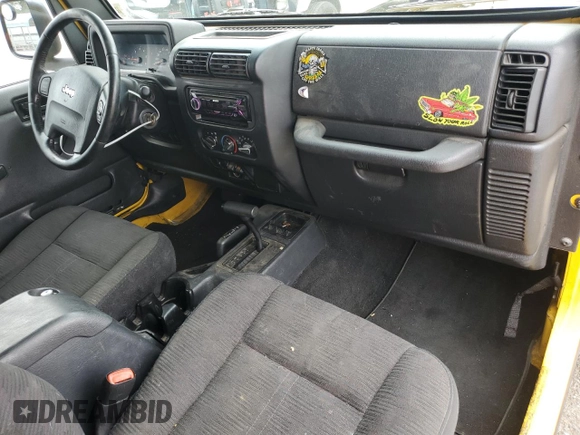 2004 Jeep Wrangler Rubicon with VIN 1J4FA69SX4P768963, listed as a Copart auction lot 56999665 with 91,949 mi miles and Salvage title. Bid and sale history available at DreamBid. Image 8.