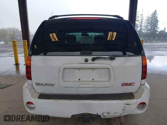 2003 GMC Envoy SLE with VIN 1GKDT13SX32319740, listed as a IAAI auction lot 41923578 with 210,811 mi miles. Bid and sale history available at carsss.com. Image 16.