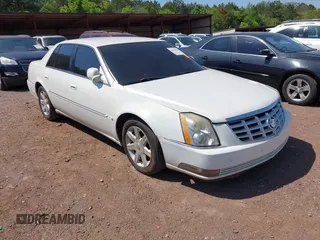 2006 Cadillac DTS w/1SC with VIN 1G6KD57Y36U116528, listed as a IAAI auction lot 42063595 with 128,839 mi miles. Bid and sale history available at carsss.com. Image 1.