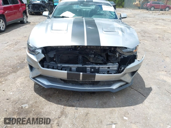 2021 Ford Mustang EcoBoost z VIN 1FA6P8TH1M5121107, wystawiony jako IAAI lot #42204097 z przebiegiem 51 542 mil mil oraz . Historia ofert i sprzedaży dostępna na DreamBid. Obrazek 6.