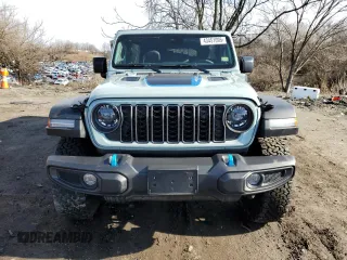 2024 Jeep Wrangler Rubicon with VIN 1C4RJXR61RW255979, listed as a Copart auction lot 43451095 with 7,258 mi miles and Salvage title. Bid and sale history available at DreamBid. Image 5.