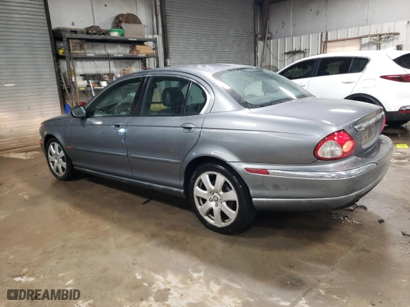 2005 Jaguar X-Type 3.0L with VIN SAJWA51C65WE28676, listed as a Copart auction lot 82850554 with NaN miles and Salvage Title. Bid and sale history available at carsss.com. Image 2.