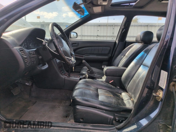 1997 Nissan Maxima GXE with VIN JN1CA21D0VT201140, listed as a Copart auction lot 52230495 with 286,440 mi miles and Clean title. Bid and sale history available at DreamBid. Image 7.