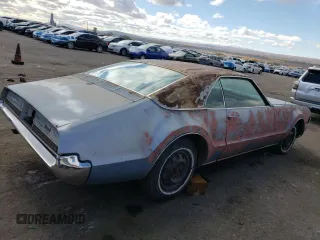 1967 Oldsmobile Toronado with VIN 396877N610043, listed as a Copart auction lot 79516854 with 242,595 mi miles and Clean Title. Bid and sale history available at DreamBid. Image 3.