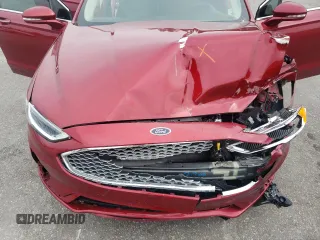 2019 Ford Fusion Titanium z VIN 3FA6P0D99KR221328, wystawiony jako Copart lot #57104515 z przebiegiem 138 427 mil mil oraz Szkoda całkowita • Salvage title. Historia ofert i sprzedaży dostępna na DreamBid. Obrazek 11.