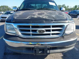 2001 Ford F-150 XLT z VIN 1FTRW07L61KC53030, wystawiony jako IAAI lot #42526499 z przebiegiem 121 675 mil mil oraz . Historia ofert i sprzedaży dostępna na DreamBid. Obrazek 13.