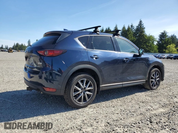 2018 Mazda CX-5 Grand Touring z VIN JM3KFBDM5J0379246, wystawiony jako Copart lot #58587865 z przebiegiem 46 339 mil mil oraz Szkody całkowita. Historia ofert i sprzedaży dostępna na DreamBid. Obrazek 3.