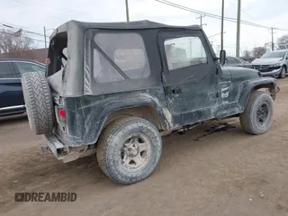 1998 Jeep Wrangler Sport with VIN 1J4FY19S9WP722431, listed as a IAAI auction lot 41872702 with 197,503 mi miles. Bid and sale history available at carsss.com. Image 4.