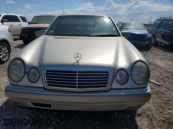 1997 Mercedes-Benz E-Class with VIN WDBJF72F2VA274233, listed as a Copart auction lot 74123554 with 80,914 mi miles and Salvage Title. Bid and sale history available at carsss.com. Image 5.