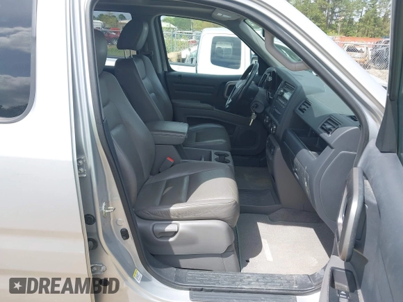 2014 Honda Ridgeline RTL with VIN 5FPYK1F53EB013752, listed as a IAAI auction lot 41886851 with 89,038 mi miles and . Bid and sale history available at DreamBid. Image 5.