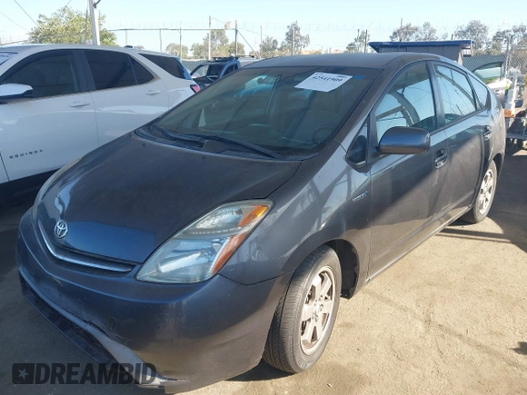 2007 Toyota Prius z VIN JTDKB20U873226409, wystawiony jako IAAI lot #42541909 z przebiegiem 128 374 mil mil oraz . Historia ofert i sprzedaży dostępna na DreamBid. Obrazek 2.