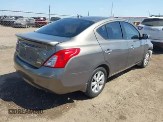 2012 Nissan Versa SV with VIN 3N1CN7AP8CL906636, listed as a IAAI auction lot 42007827 with 111,627 mi miles. Bid and sale history available at carsss.com. Image 4.