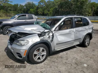2012 BMW X5 35d with VIN 5UXZW0C51CL668064, listed as a Copart auction lot 62217845 with 140,544 mi miles and Salvage title. Bid and sale history available at DreamBid. Image 1.
